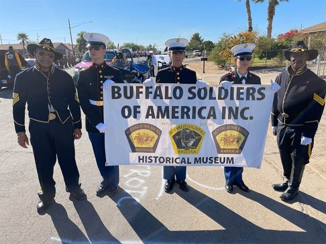 Marching with the Historical Museum banner