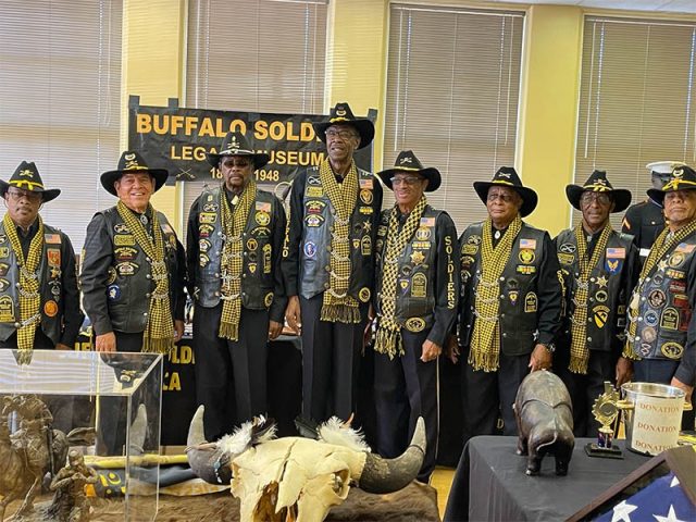 Members with the traveling museum display